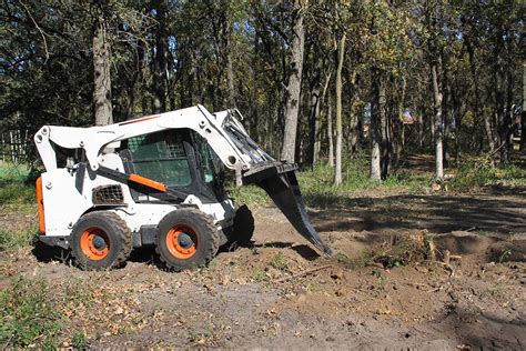 digging a trench with a skid steer bucket|standard skid steer bucket size.